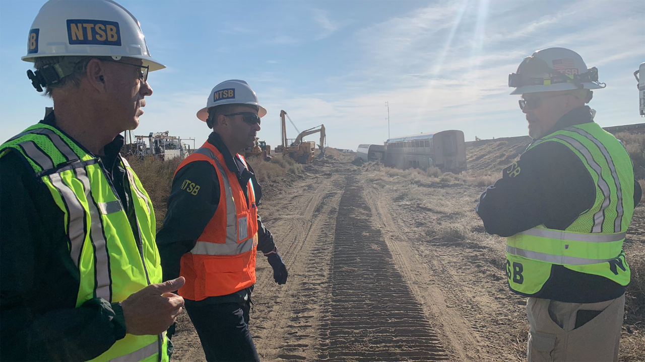 Pictured: NTSB Vice Chairman Bruce Landsberg, investigator John Manutes and Investigator-In-Charge Jim Southworth at the scene of the Amtrak derailment near Joplin, Mont. (Caption and Photograph: Courtesy of NTSB, via Twitter, Sept. 27)