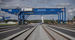 Pictured: Workers assemble a rail-mounted gantry crane at the Georgia Ports Authority's Mason Mega Rail Terminal in Savannah on Oct. 21, 2021. (Caption courtesy of GPA; GPA Photo/Stephen B. Morton)